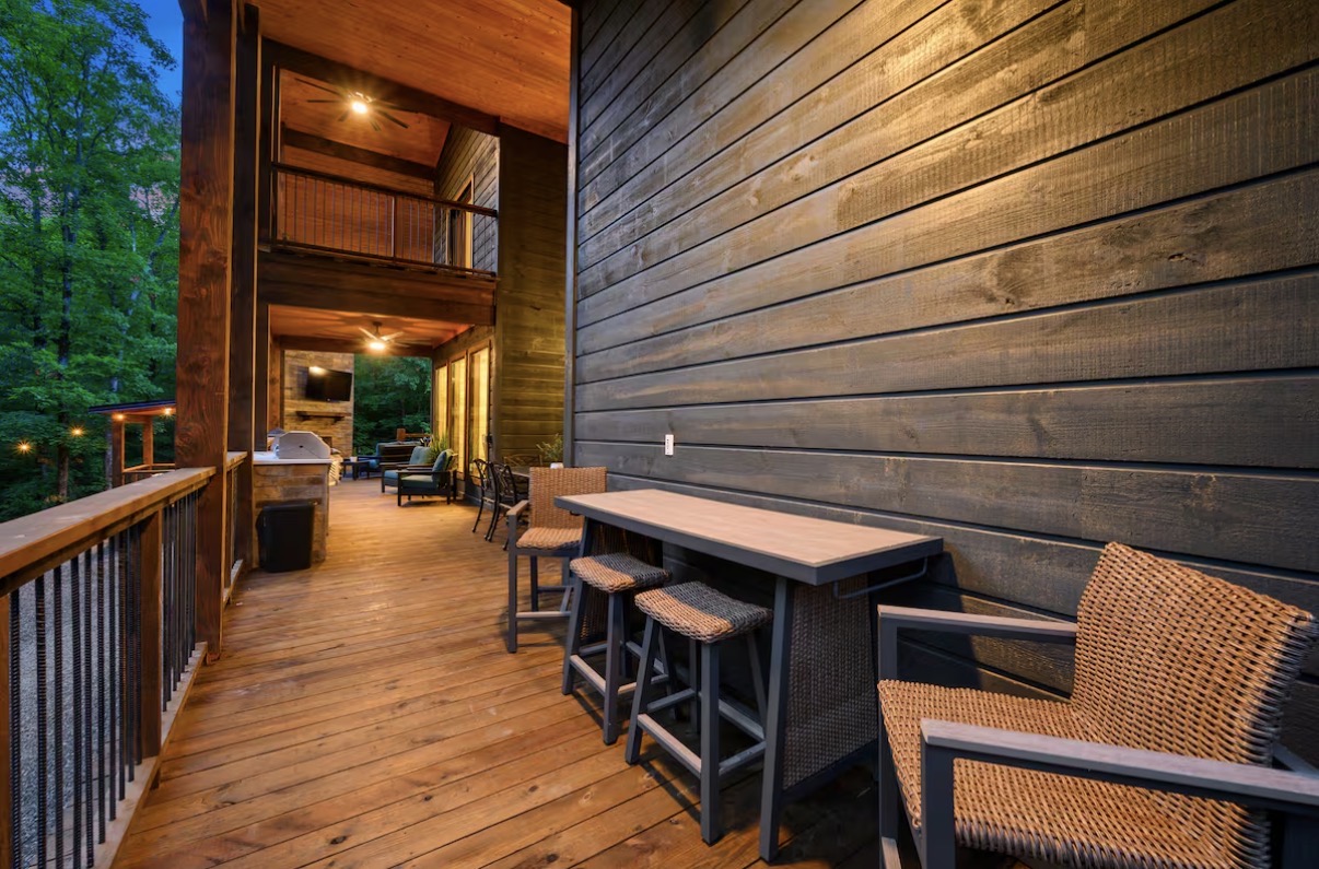 As Good As It Gets — deck bar-height dining with wicker seating