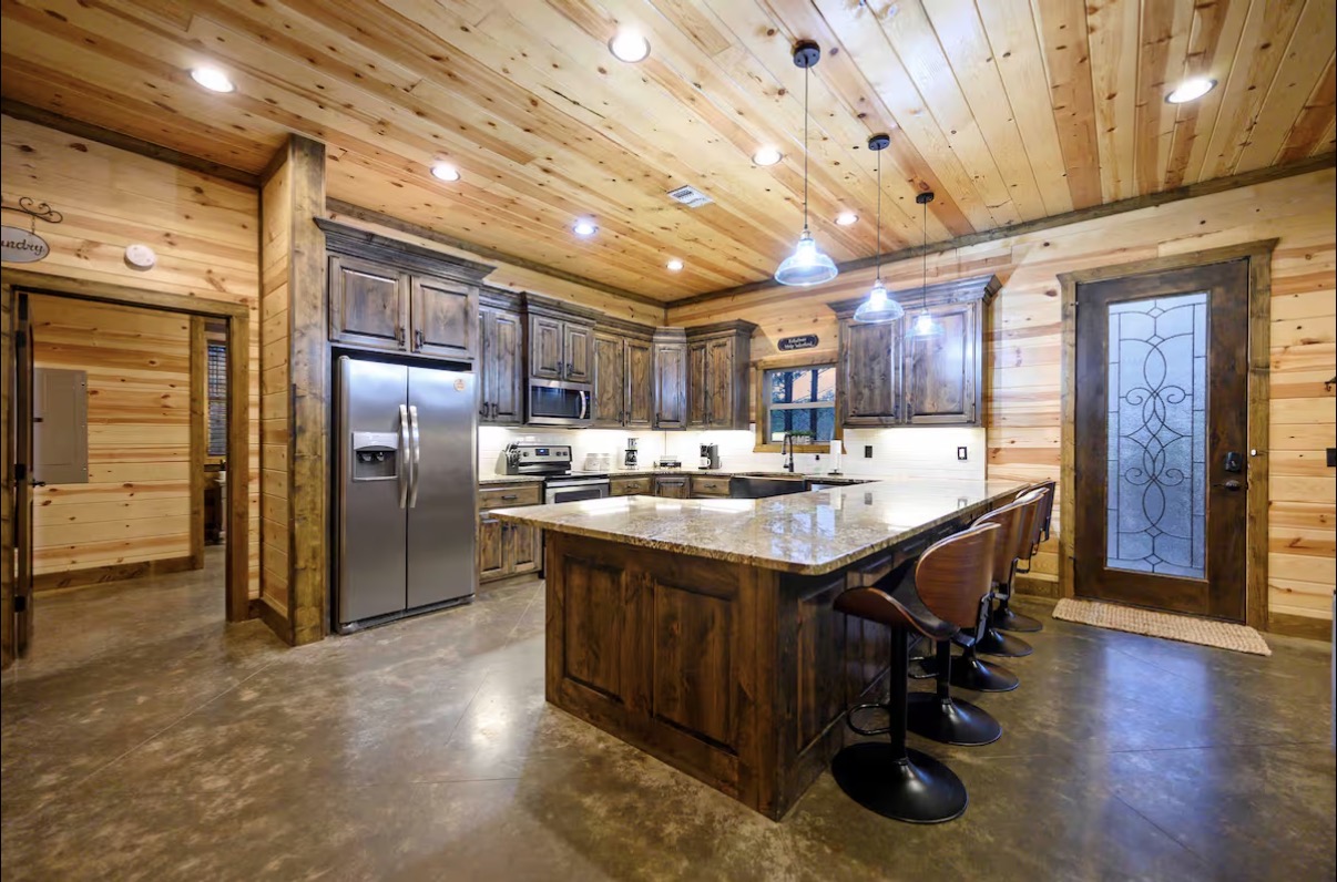 Sound of Sunshine — chef's kitchen with granite island and barstool seating