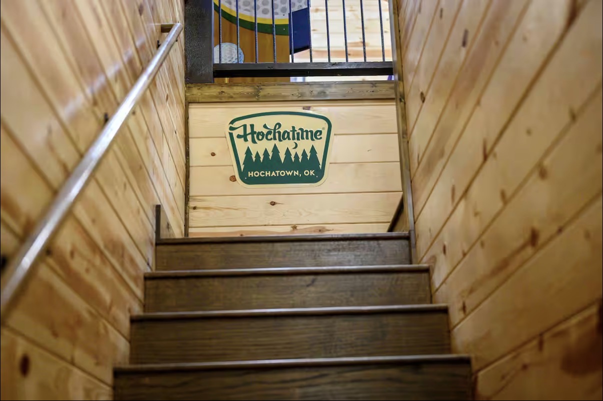 Sound of Sunshine — stairway up to the game loft with Hochatime sign