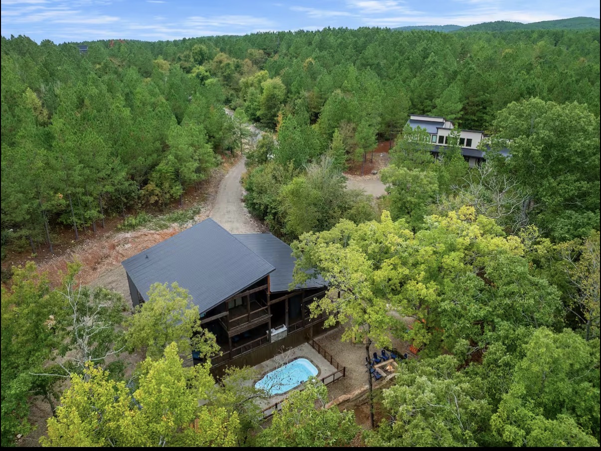 As Good As It Gets — aerial view of cabin with private pool in the pines