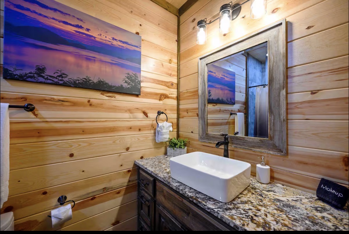 Sound of Sunshine — vessel-sink vanity with framed mirror and lake canvas