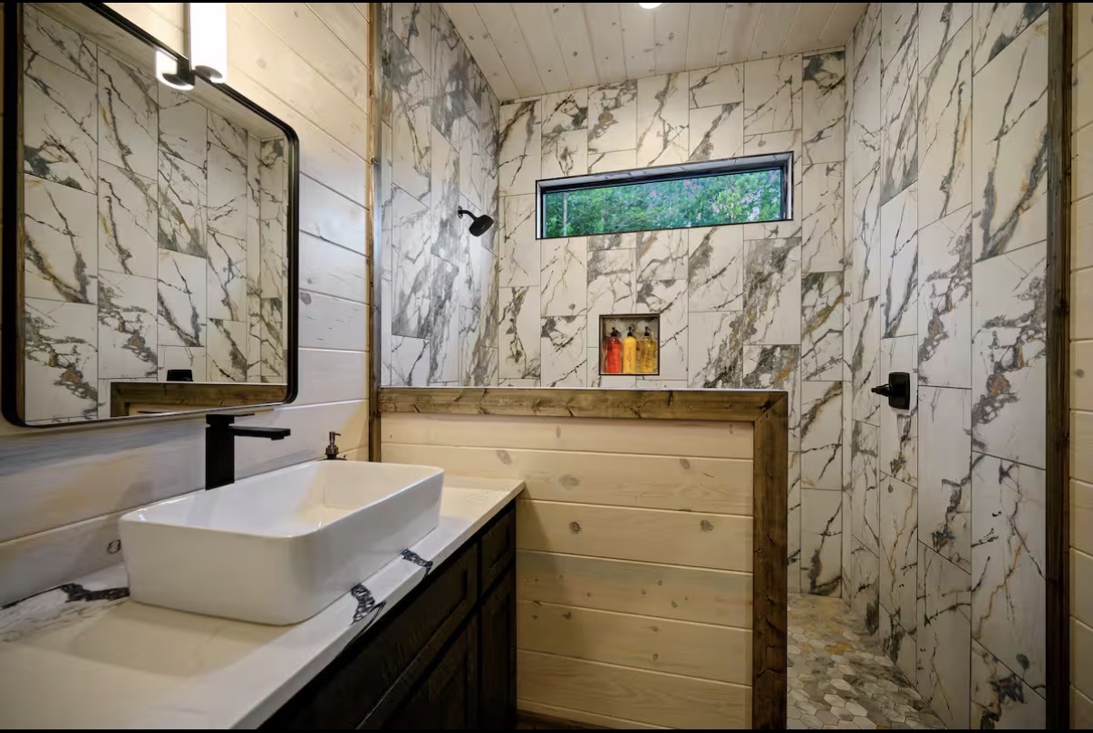 As Good As It Gets — marble-tiled walk-in shower bathroom