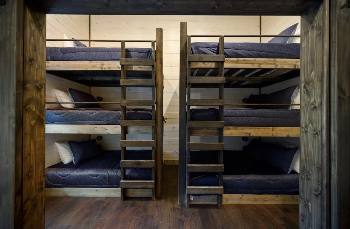 As Good As It Gets — bunk room with triple-stacked beds