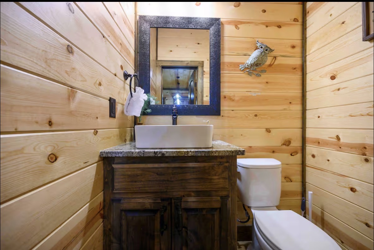 Sound of Sunshine — powder bath with vessel sink and hammered mirror