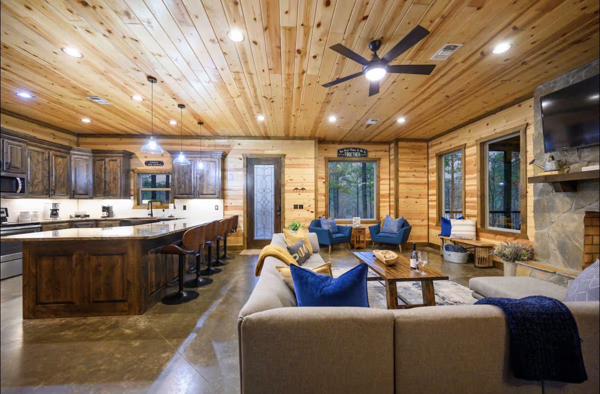 Sound of Sunshine — great room wide view with sectional, dining and kitchen