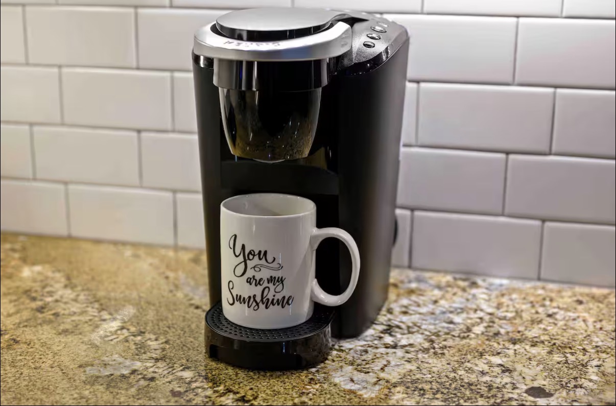 Sound of Sunshine — Keurig single-serve brewer with 'You Are My Sunshine' mug