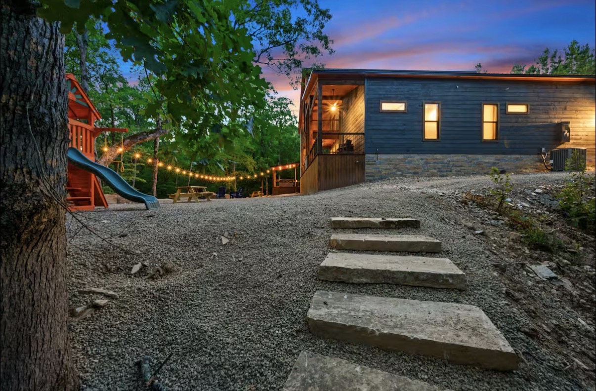 As Good As It Gets — stone steps leading up to the cabin and playset