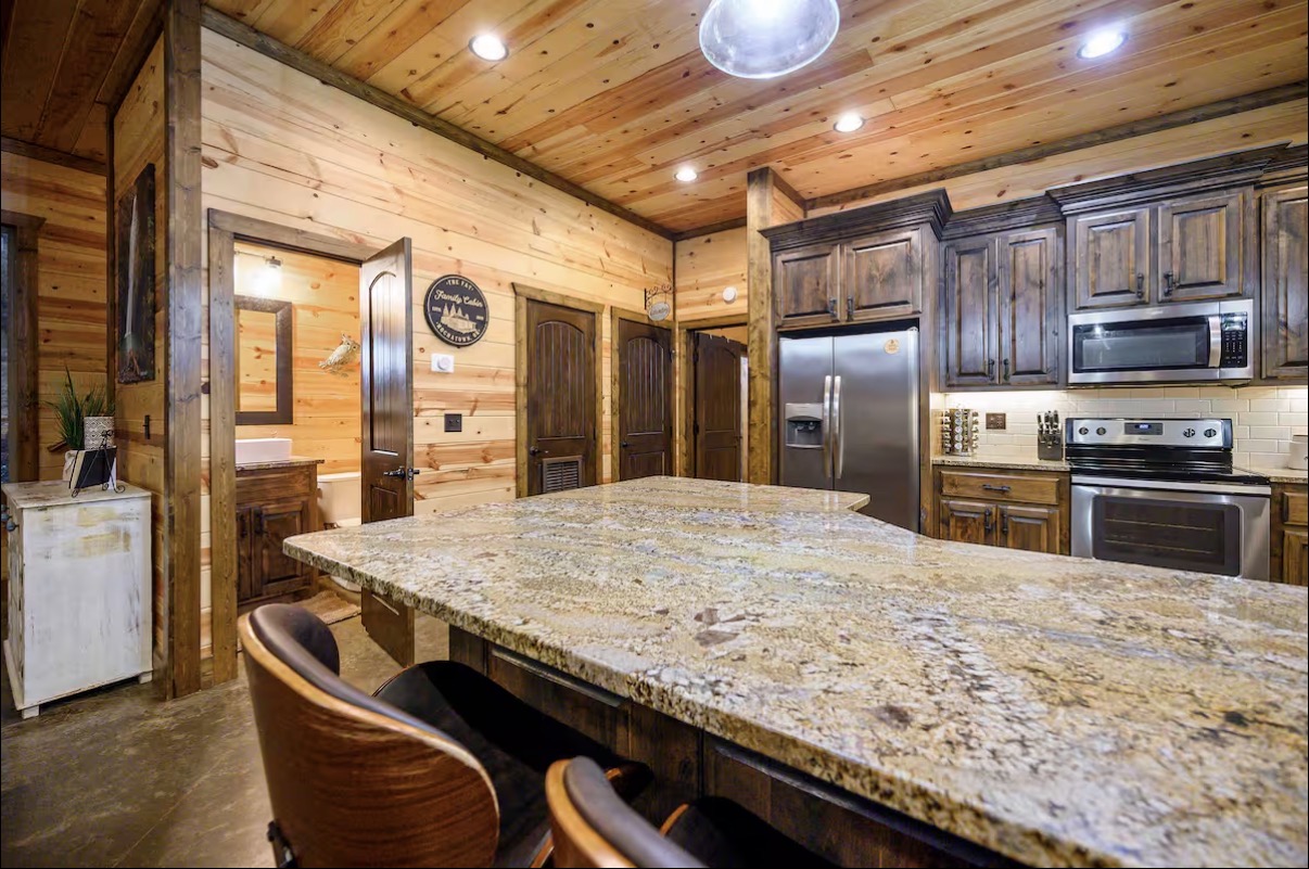 Sound of Sunshine — kitchen island toward powder bath and appliance wall