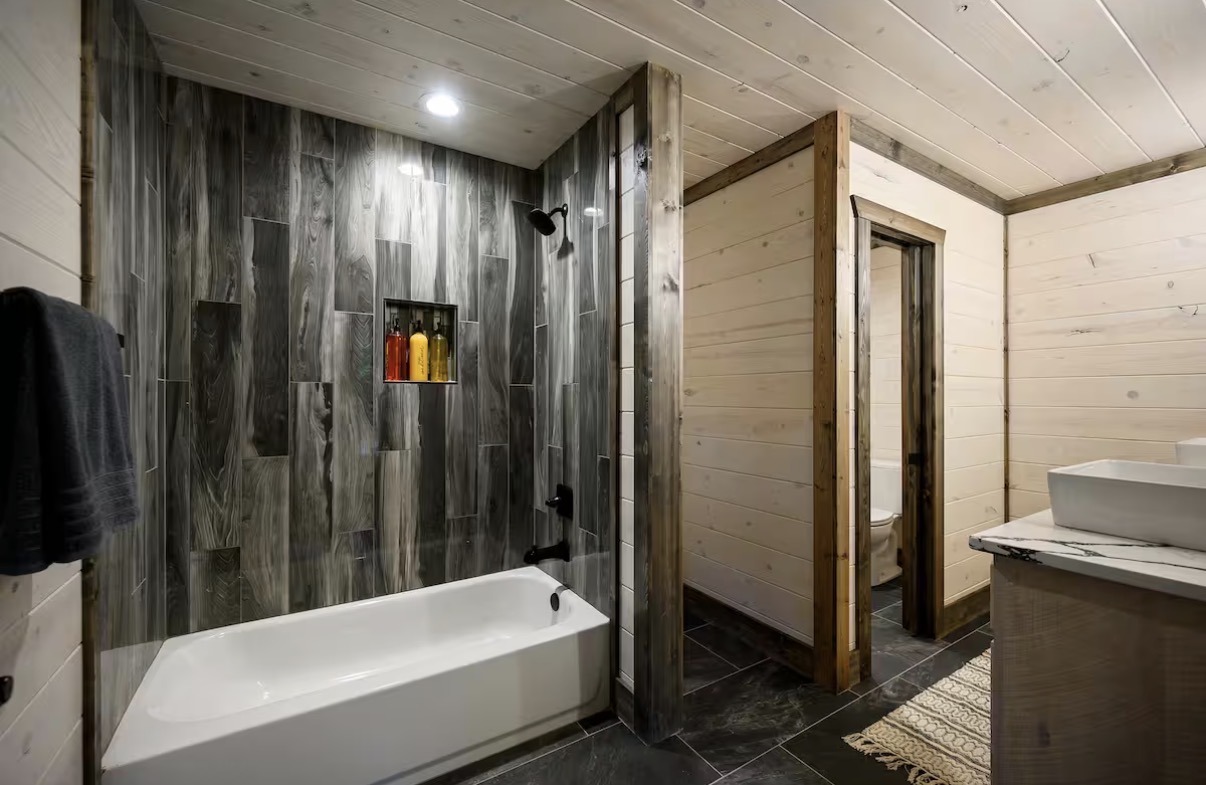 As Good As It Gets — en-suite bath with wood-look tile shower and tub
