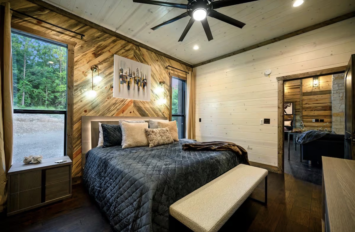 As Good As It Gets — king bedroom with picture window and forest view