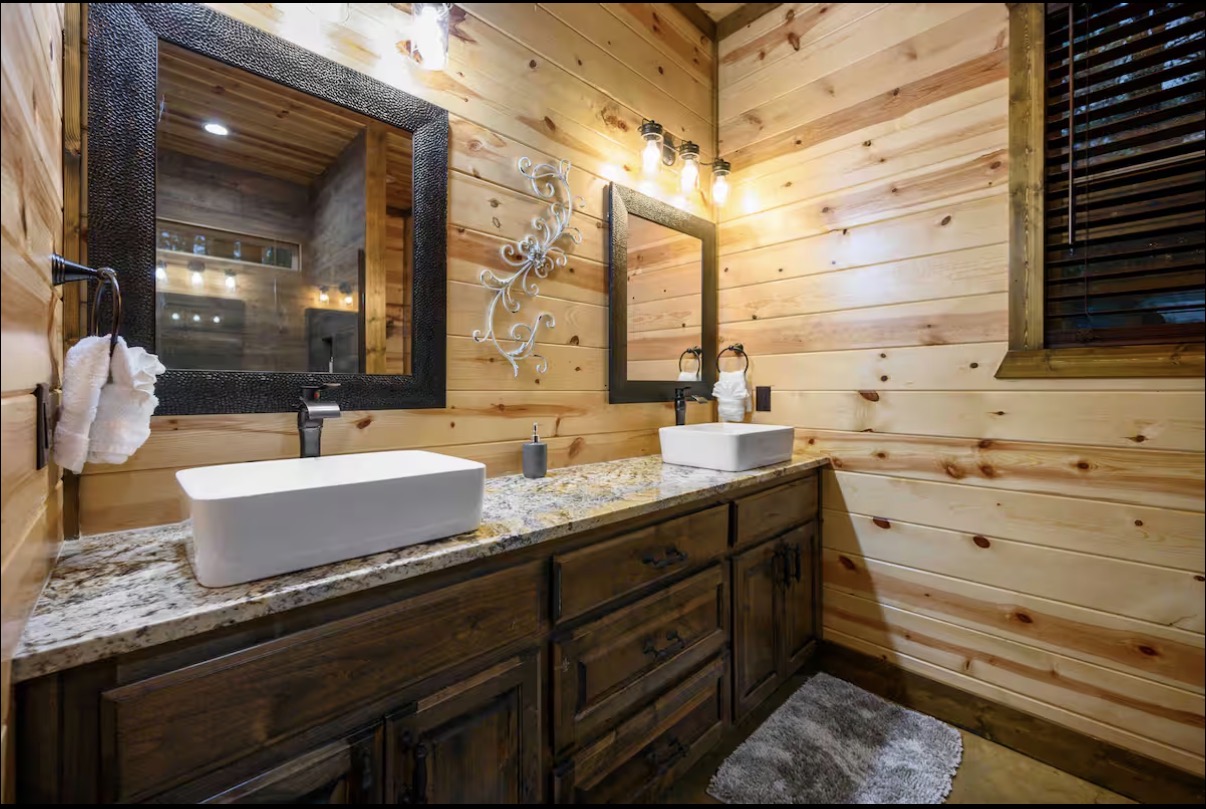 Sound of Sunshine — double-vanity bathroom with vessel sinks and granite counter