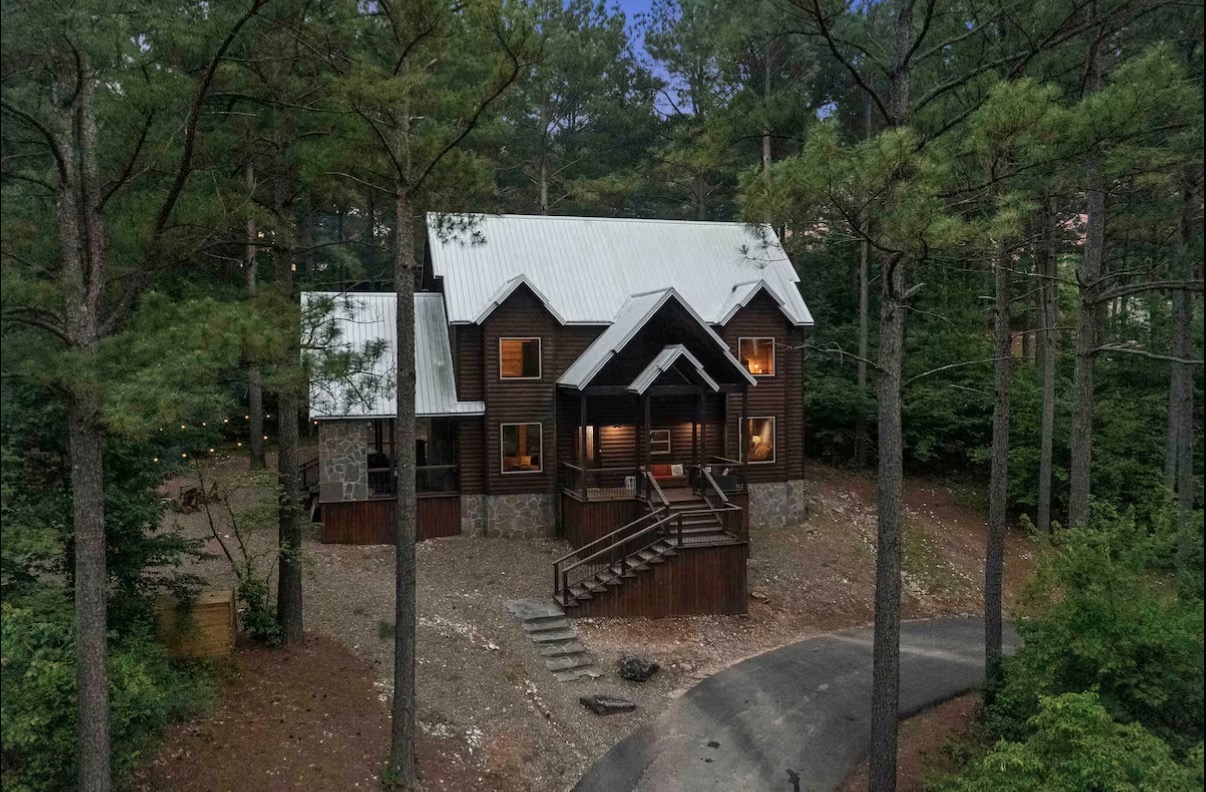 Sound of Sunshine — front elevation with covered porch and stone accents