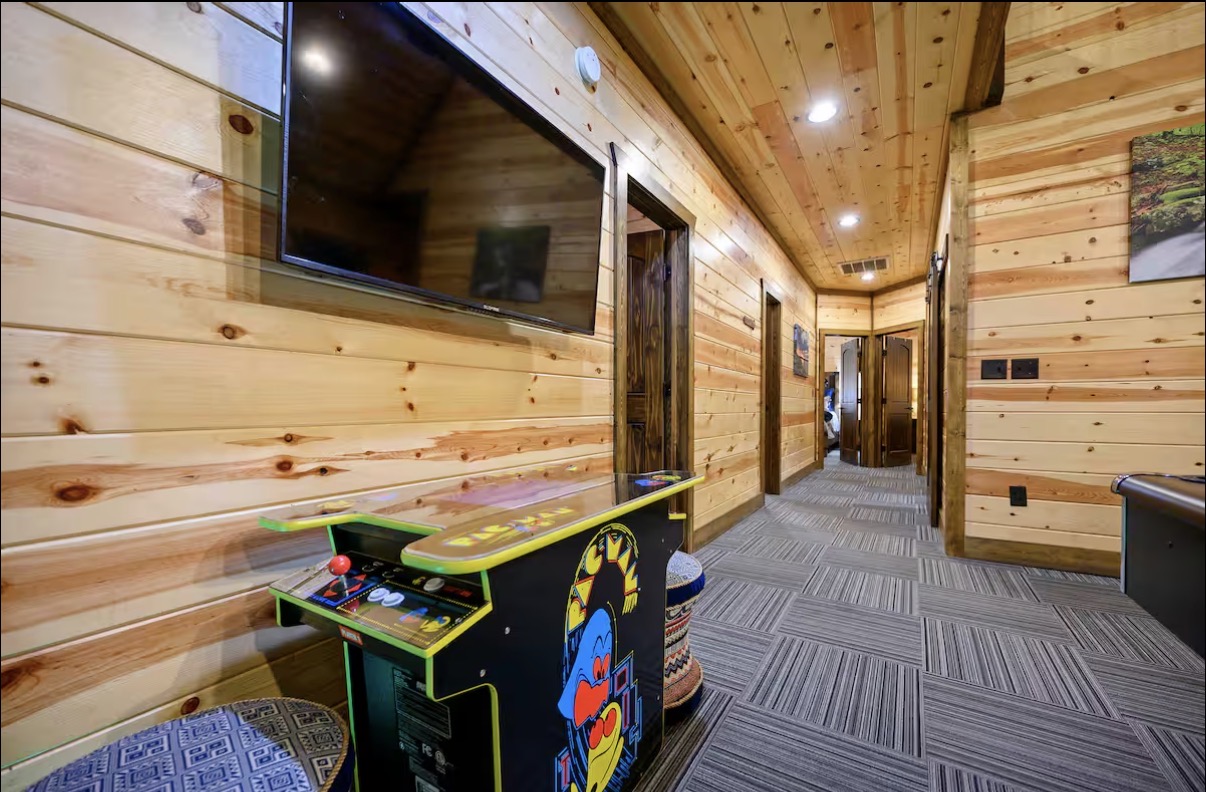 Sound of Sunshine — upstairs bedroom hallway with Pac-Man arcade