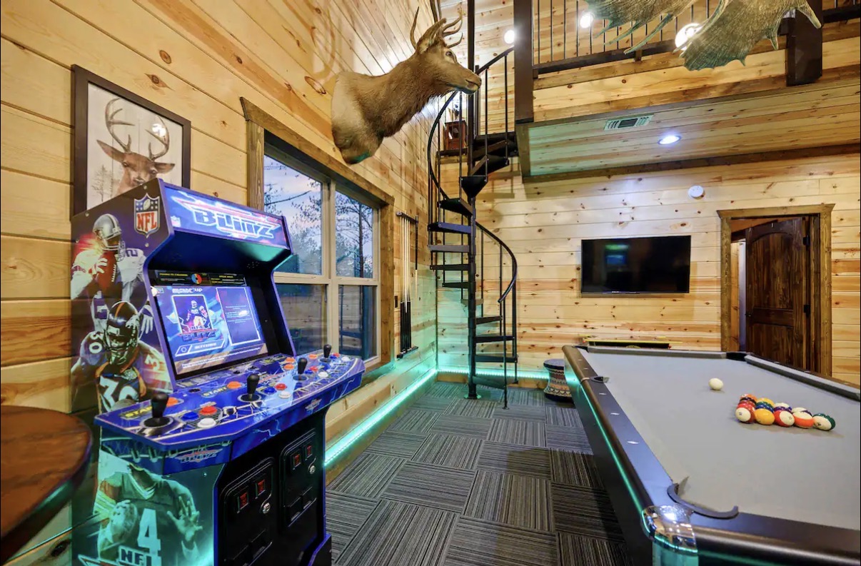 Sound of Sunshine — NFL Blitz arcade, spiral stairs and mounted deer