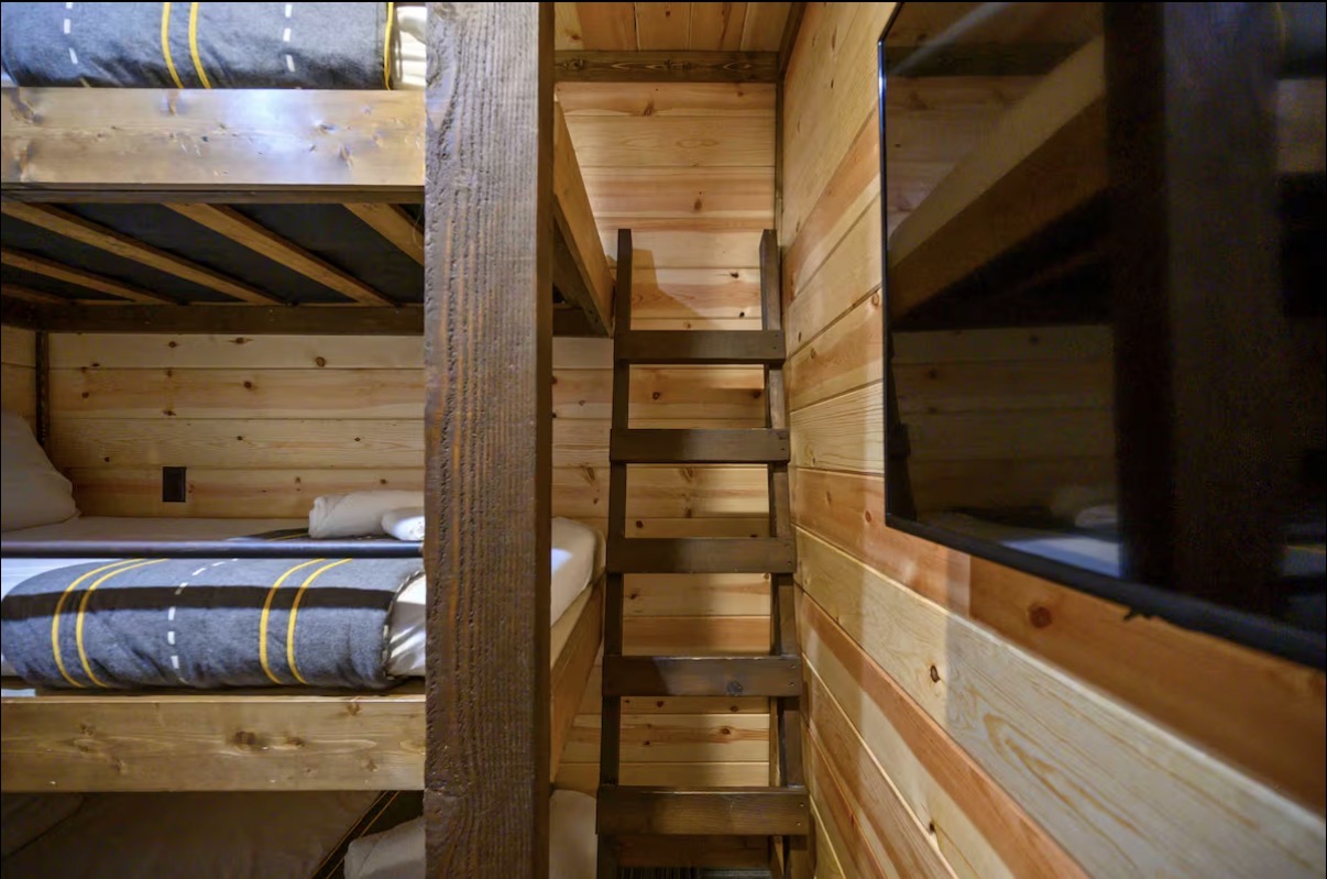 Sound of Sunshine — bunk room detail with ladder between stacks