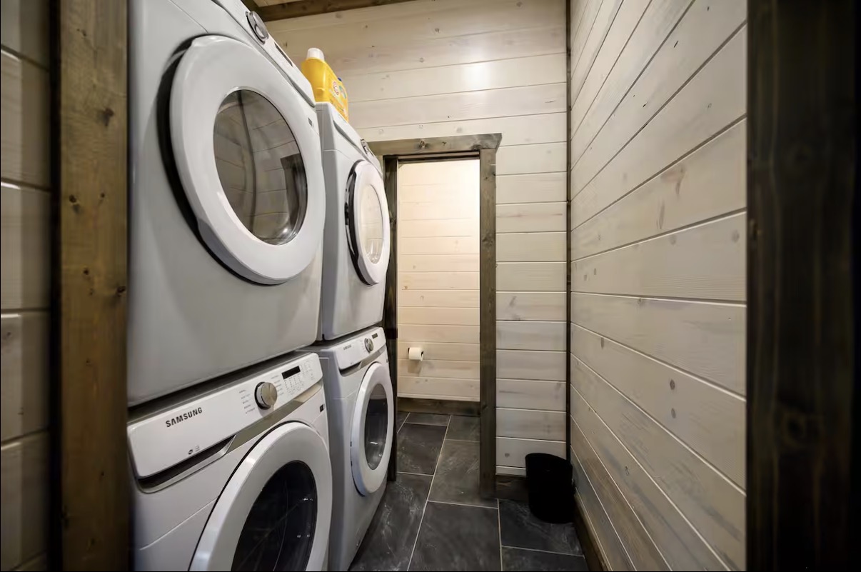 As Good As It Gets — laundry room with two stacked washer and dryer sets